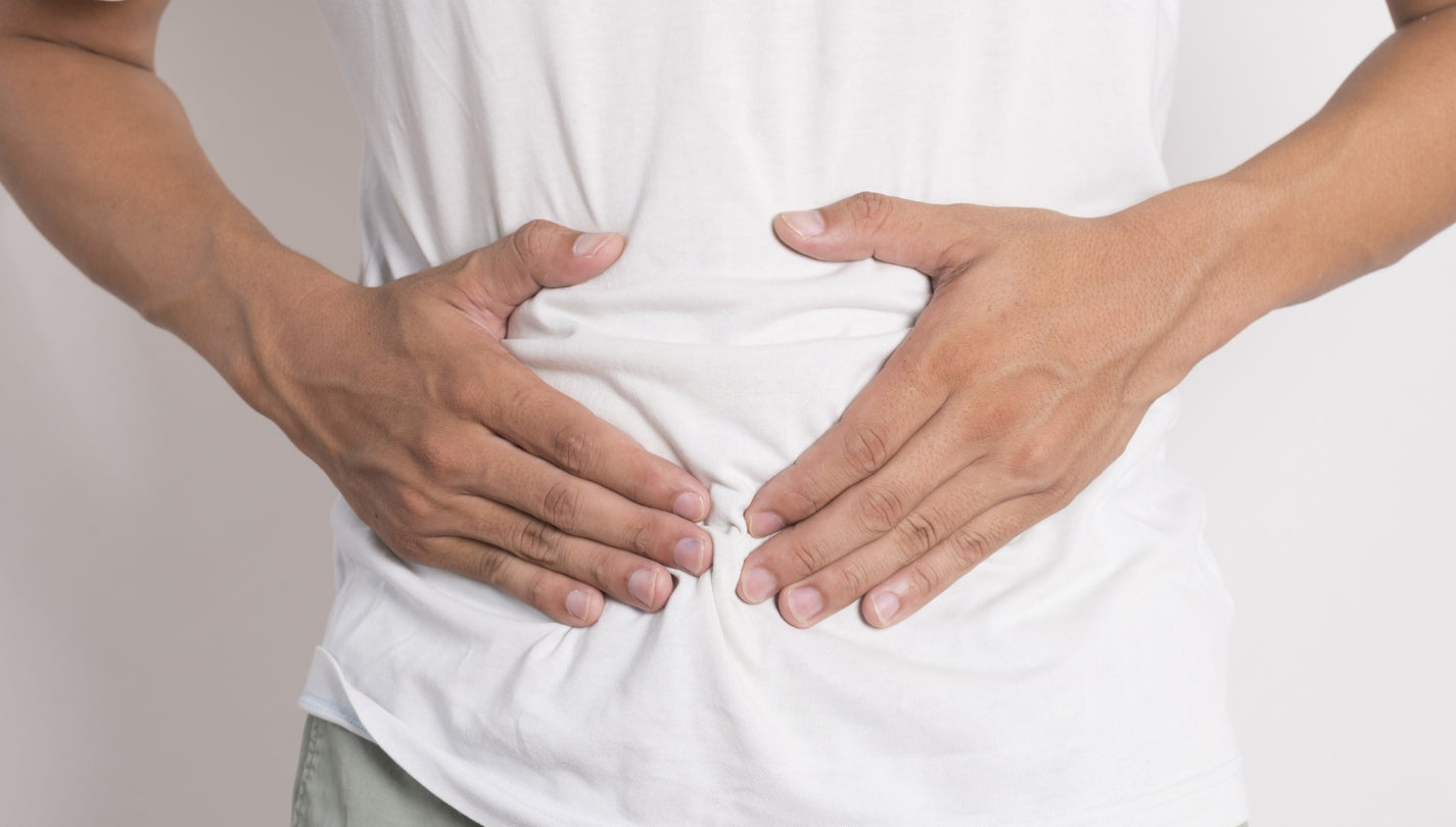 Hænder på en mave i balance